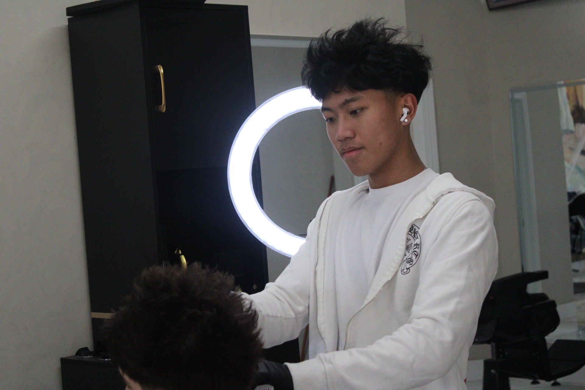Professional portrait of Rich Zhang, Barber at Euro Styles Barbershop in Michigan