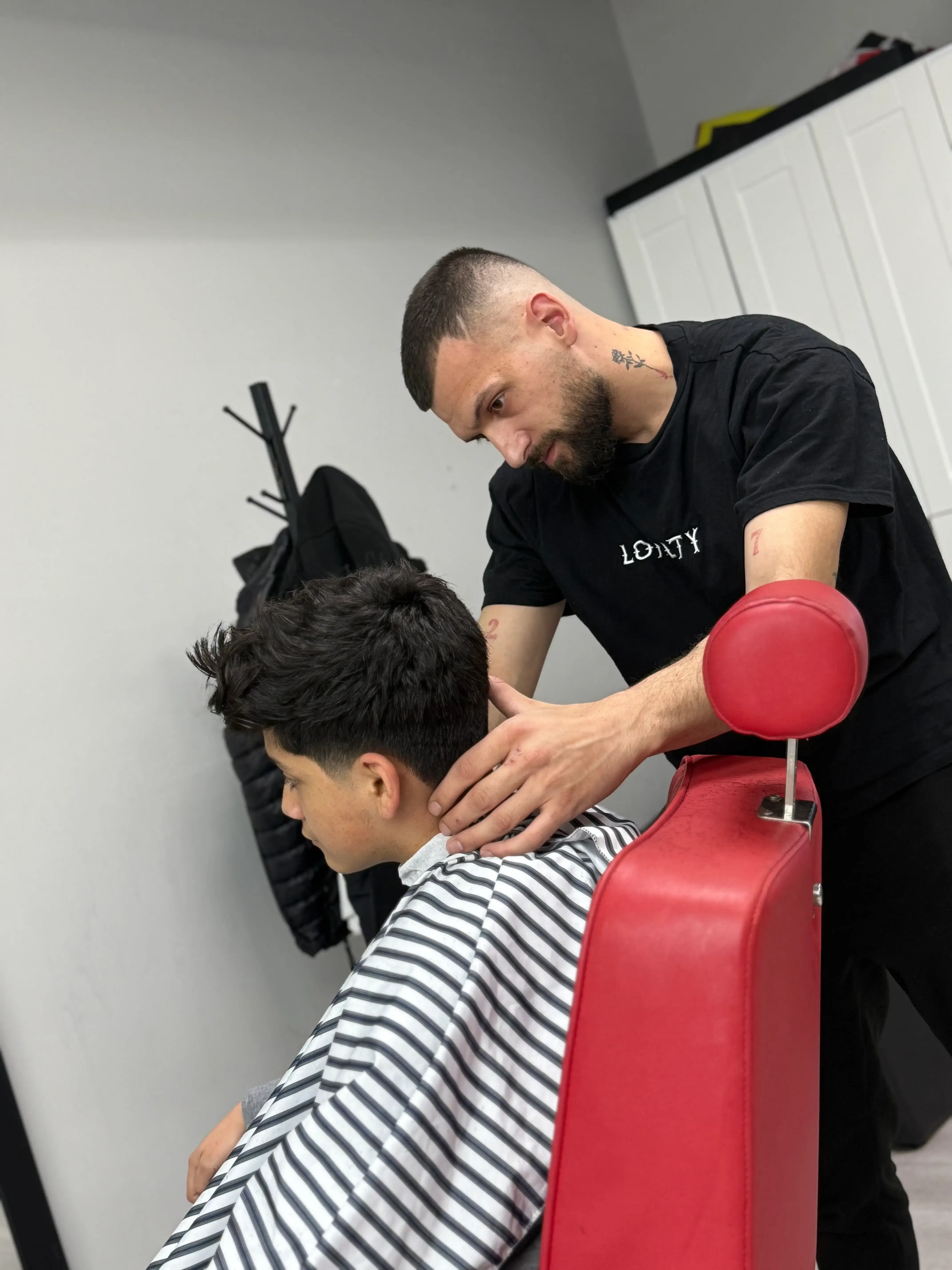 Professional portrait of Enzo, Barber at EuroStyles Barbershop in Michigan
