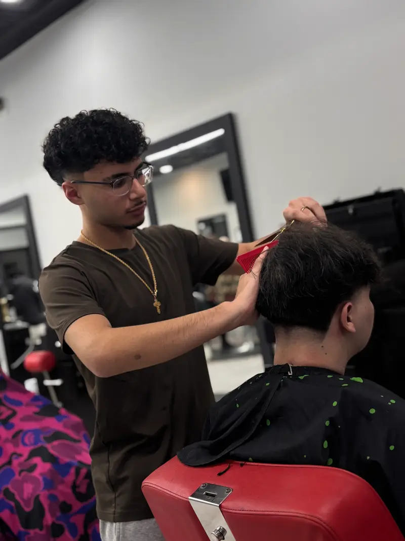 Professional portrait of Mathews Kamel, Barber at Euro Styles Barbershop in Michigan