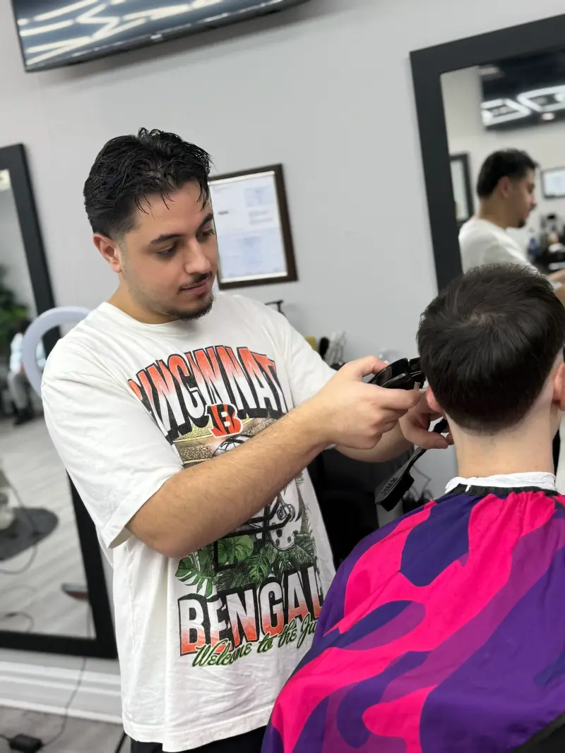 Professional portrait of Oneer Solaiman, Co-founder and Barber at Euro Styles Barbershop in Michigan